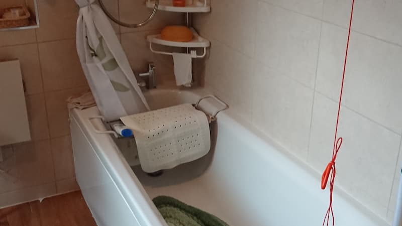 Bathtub with emergency switch nearby
